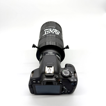 Camera with lens attached on a white background. Avast Marine Porthole Studio for DSLR. 3D-printed underwater coral and fish photography gear. Black camera lens with accessories on a white background. 