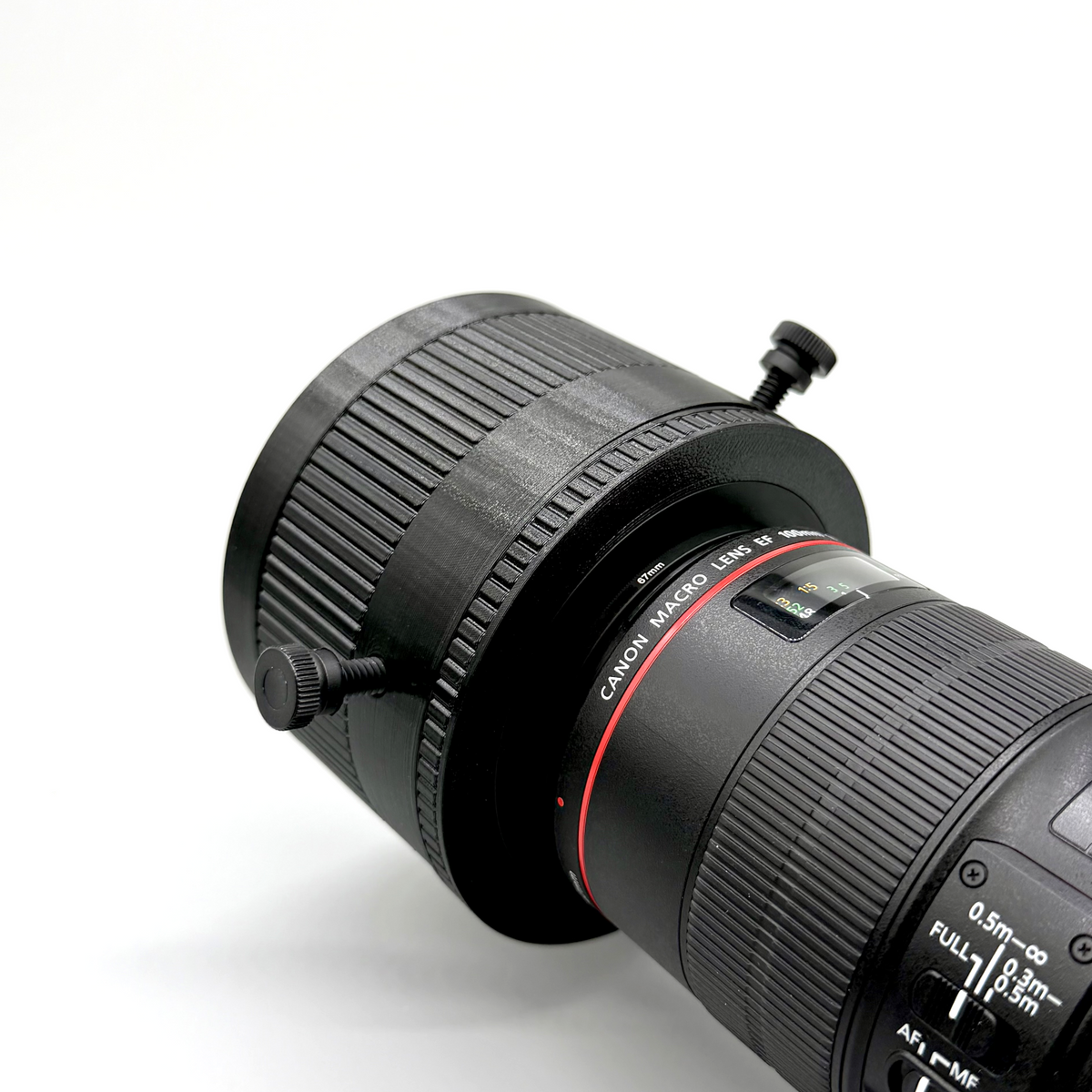 Canon camera lens with a close-up of the focus ring on a white background
Porthole Mark II Prime Interface. Camera lens adapter on a white background