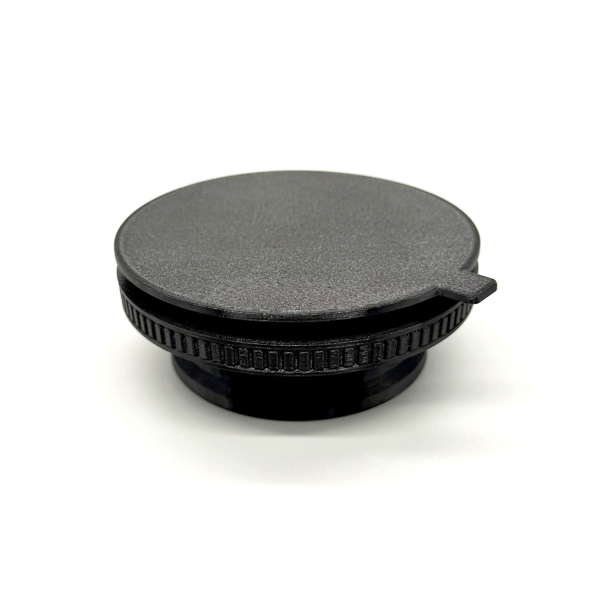 Porthole Mark II Prime Interface. Black camera lens cap on a white background